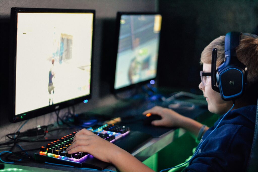 Teenage playing video game